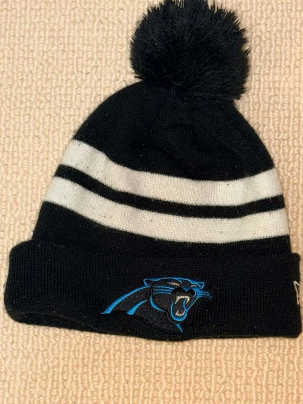 New Era Carolina Panthers NFL Black and White Stripe Cuffed Pom Knit Beanie